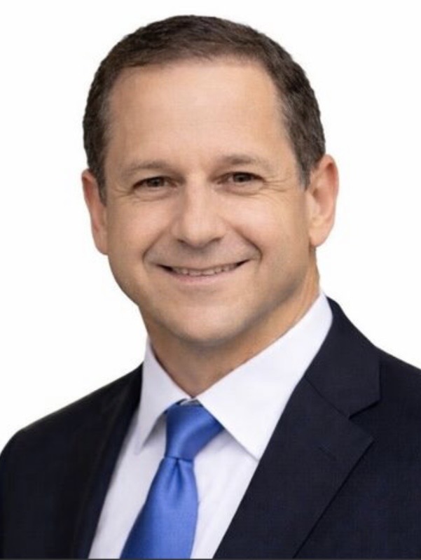 Professional headshot of Terry Curtis, Broker Associate and Agent Development Manager at ERA Experts, smiling in a dark navy suit and blue tie against a white background.